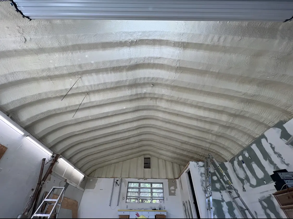 Spray polyurethane foam applied to the underside of a metal roof deck in Seven Corners